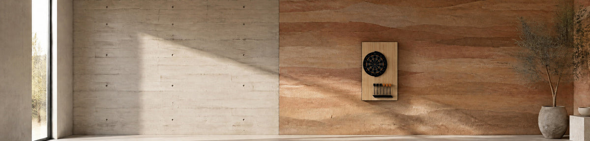 11 Ravens Robin Dartboard in a modern games room with a stamped concrete wall